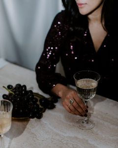 beautiful woman holds glass of champaigne