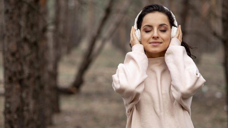 woman wearing headphones outdoors